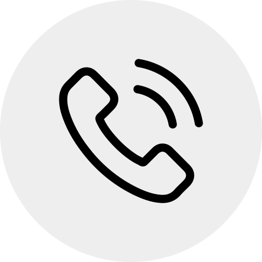 Icon showing a telephone handset with three curved lines above it, indicating a ringing or active phone call, centered within a light gray circle.
